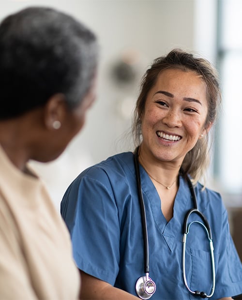 Nurse smiling at senior